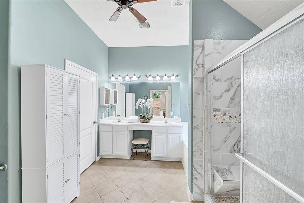 This primary ensuite bathroom just underwent a complete shower renovation! Spa like colors and finishes, bathed in light.