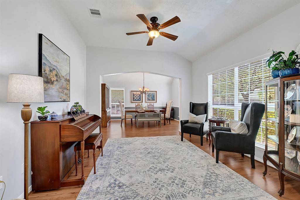 Formal living attached to dining, makes this a very versatile and livable space to enjoy! Look at all of that natural light.