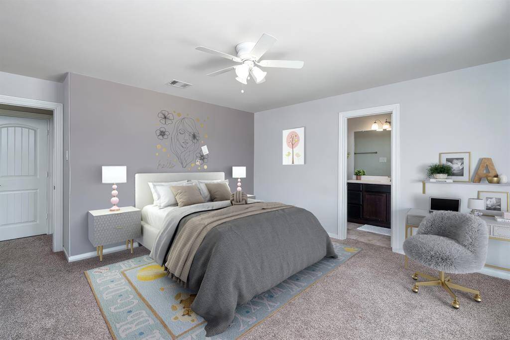 This charming bedroom suite boasts a ceiling fan for comfort, a striking custom accent wall, and plush carpet, creating the perfect retreat. *Virtually Staged*