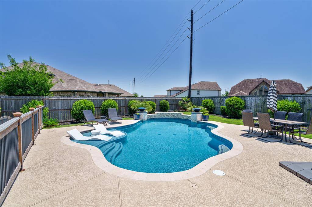This gorgeous home offers the ultimate summer oasis with a sparkling pool—perfect for relaxing, entertaining, and making lasting memories.