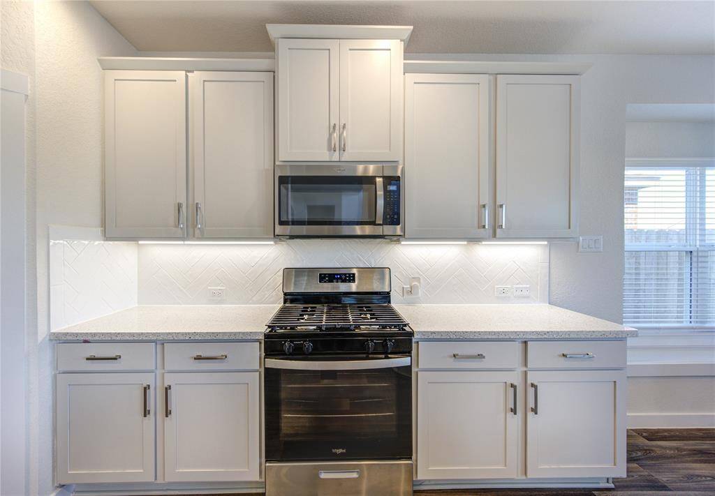 Kitchen includes under cabinet lighting and 42" cabinets