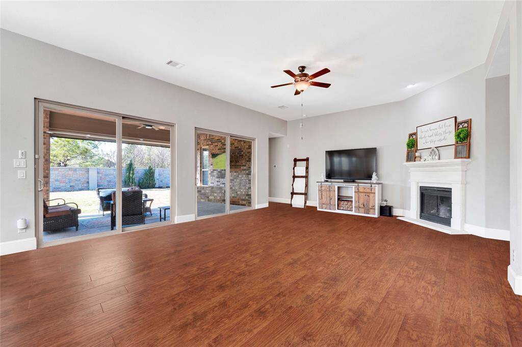 Upgraded double sliding doors leads you to extended outdoor patio