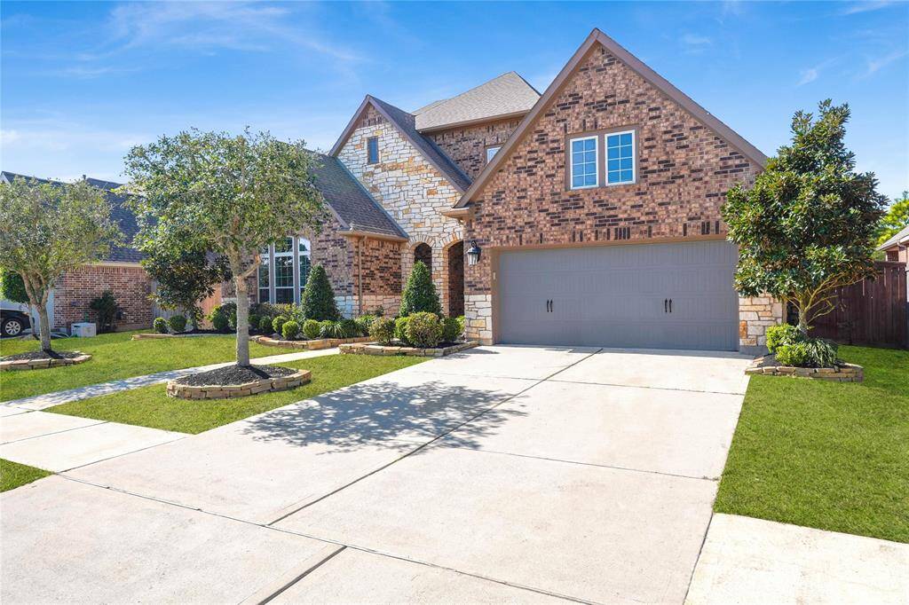 3 Car Tandem Garage and welcoming front porch area
