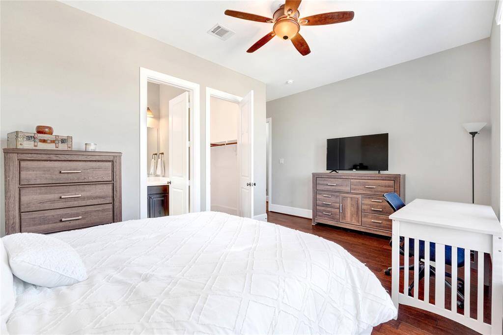Interior bathroom and spacious walk-in closet inside extended bedroom