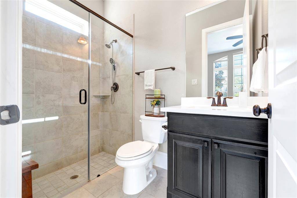 Walk in shower in private bathroom inside downstairs bedroom