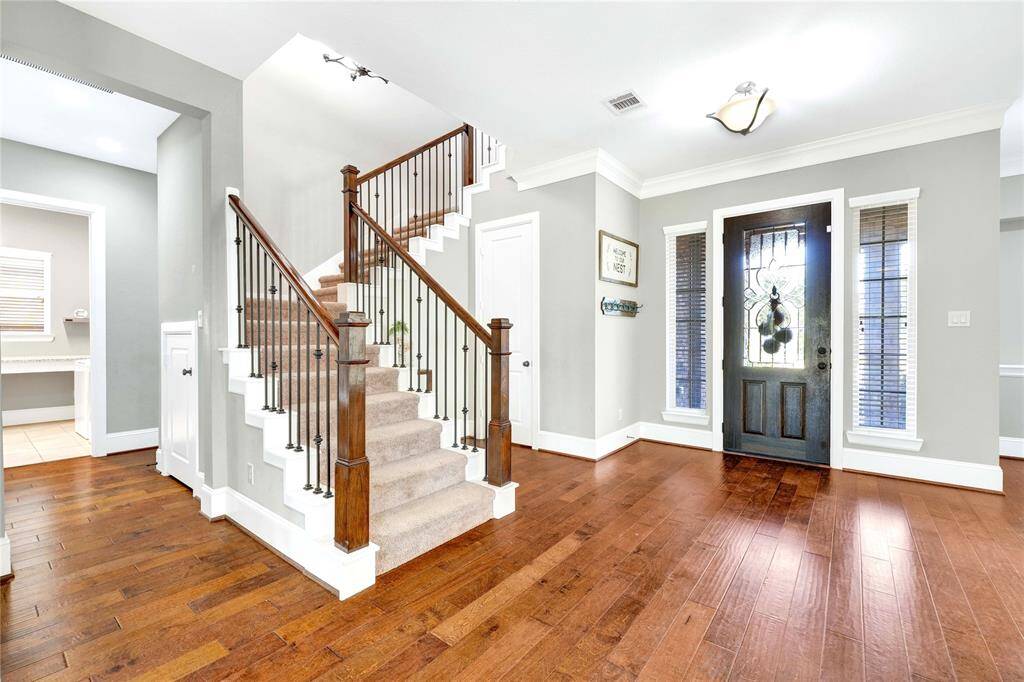 Upstairs leads you to a flex space with two large secondary bedrooms and a full bathroom