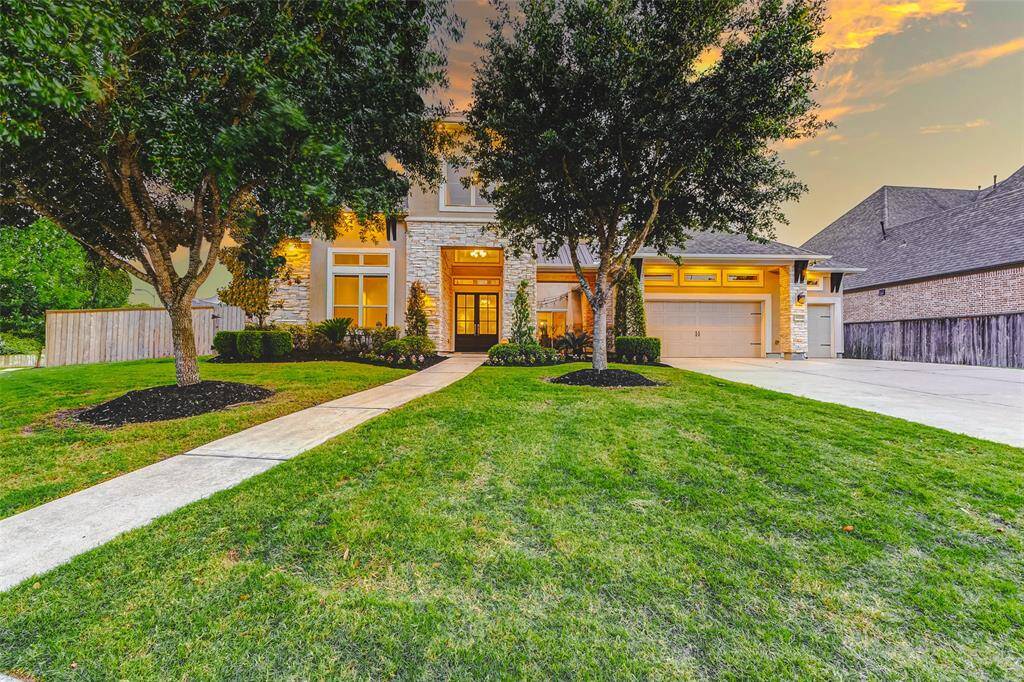 Welcome to 30715 Crest View Terrace, a distinguished residence nestled in the prestigious community of Fulbrook on Fulshear Creek. This exceptional home boasts a highly desirable floor plan centered around a private open-air courtyard. With timeless curb appeal, the exterior showcases an artful combination of stone and stucco, enhanced by meticulously designed landscaping.