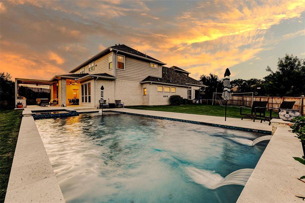 Just in time for summer—this outdoor oasis is designed for ultimate relaxation and entertaining, featuring a shimmering pool and spa surrounded by plenty of greenery and inviting spaces to unwind.