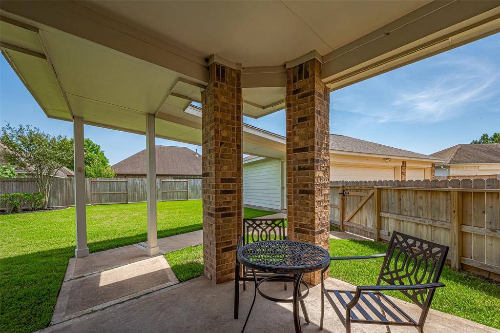 Covered Patio out back overlooking huge back yard