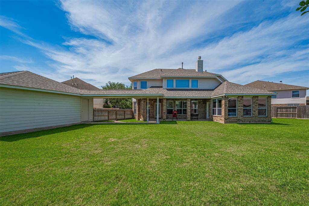 Detached 3 car garage covered walk way and back patio