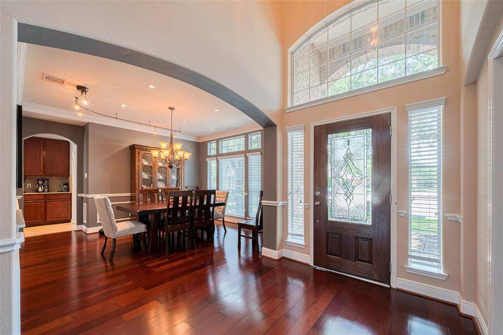 Gorgeous wood floors at entry through living spaces,