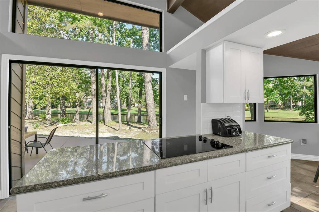 Prepare meals, step outside these glass doors and serve your guests on the patio.