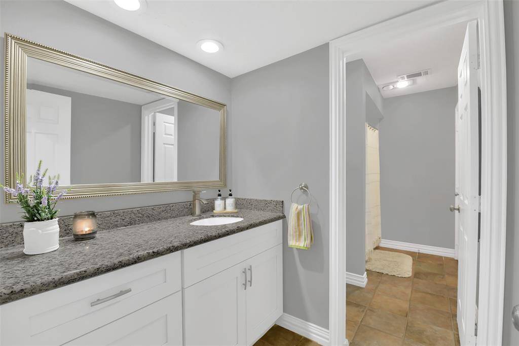 Nice size full bath attached to bedroom - with doors separting shower area for privacy