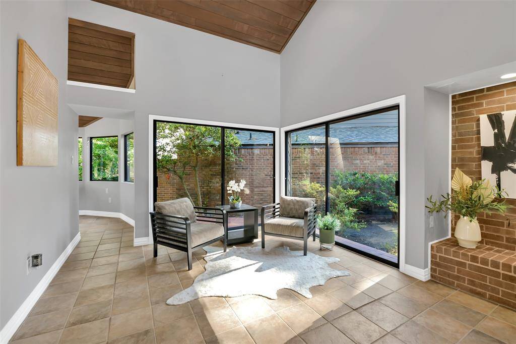 Sitting area in the Family Room - relaxing view - imagine a waterfall outside these glass windows