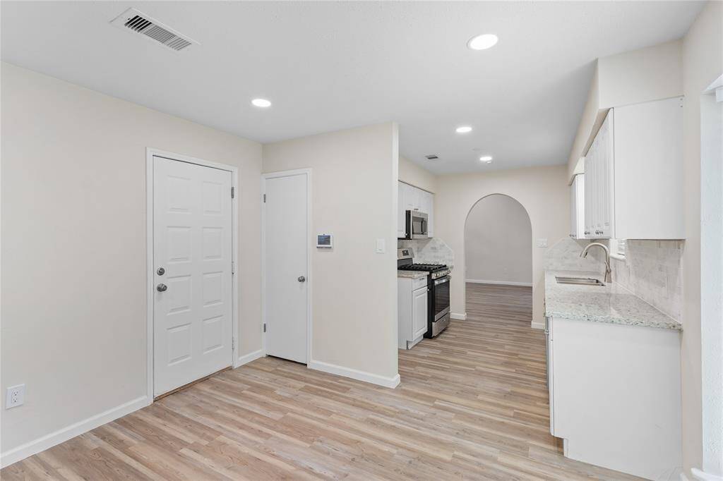 Seamless transitions between rooms w/ single flooring in all living spaces & bedrooms. NO CARPET
