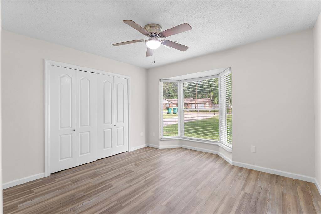 Secondary bedroom #1 with bay windows.