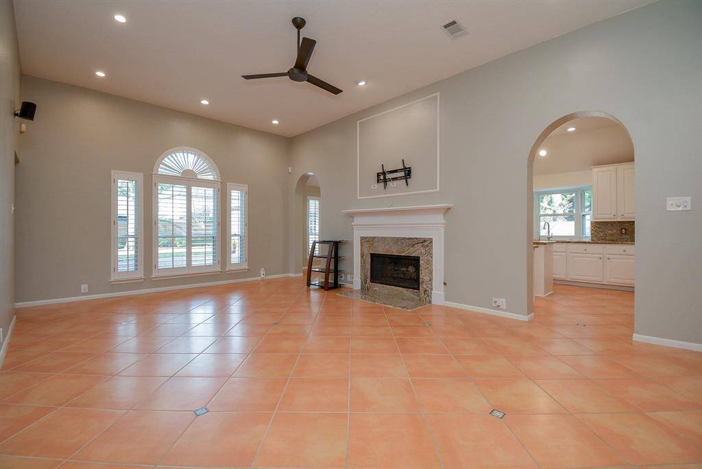 The large family room is the heart of the home and connects all spaces.  Updated LED canned lights and energy efficient ceiling fan bring comfort and energy efficiency to this home.