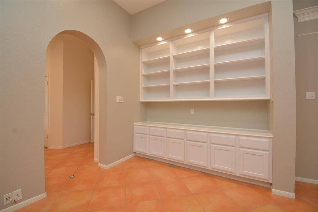 Large built ins with shelves, cabinets and drawers for books, toys, photo frames or anything you would like to display.