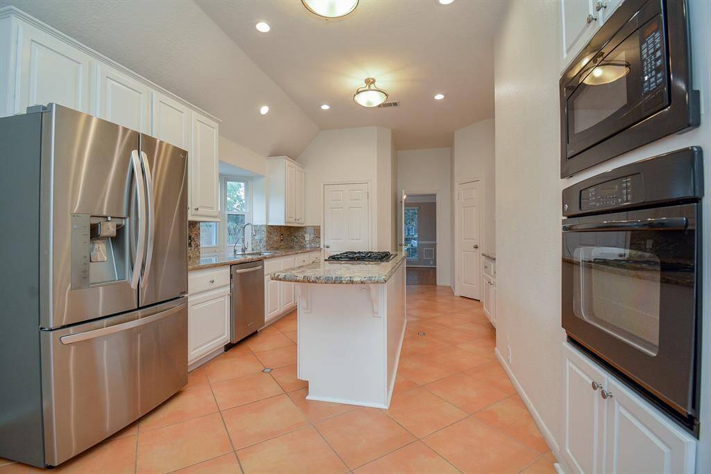Recent LG refrigerator and Kitchen Aid dishwasher.  Built in GE profile oven and microwave