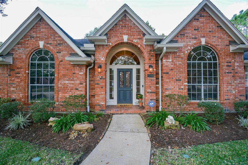 High ceilings allow for large windows in the formal living room and front bedroom