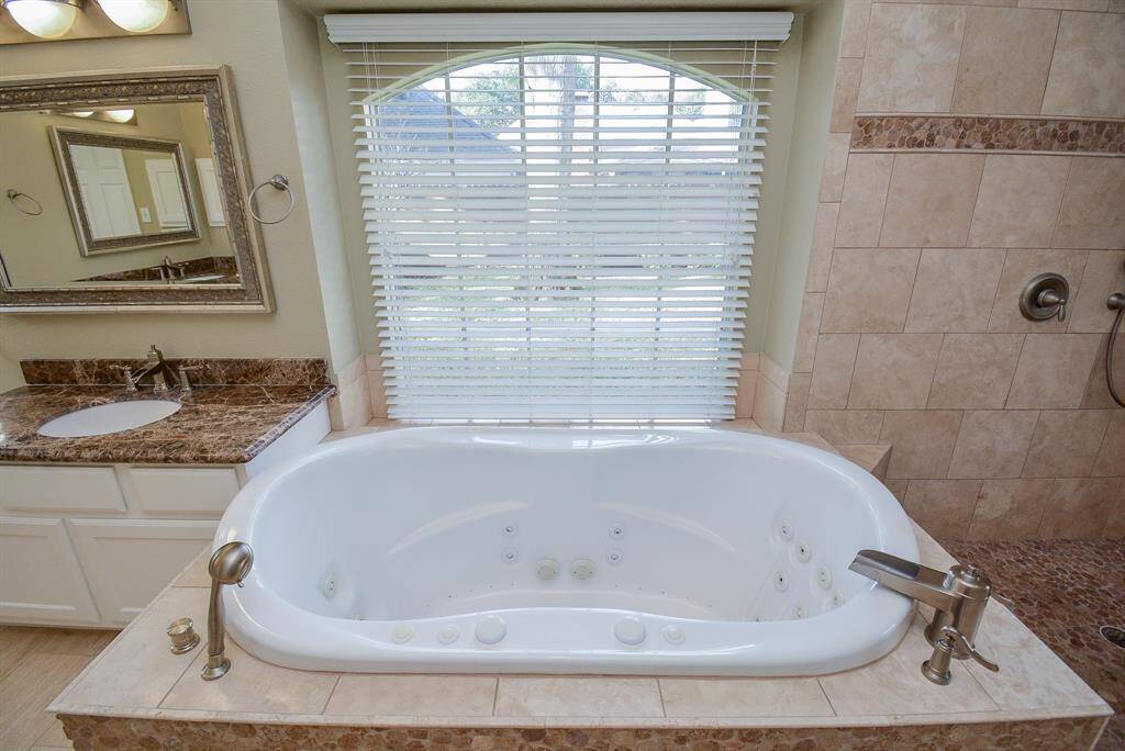 Imagine taking a warm bath with views to the backyard.