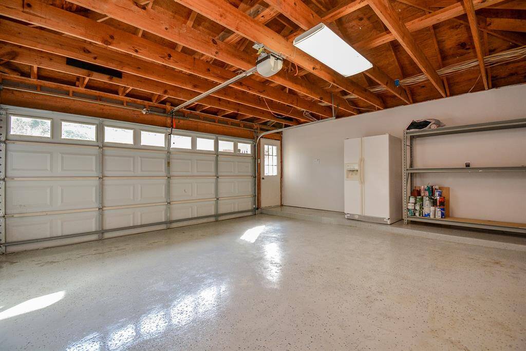 Finished garage with expoxy floors, shelves and a bonus fridge!