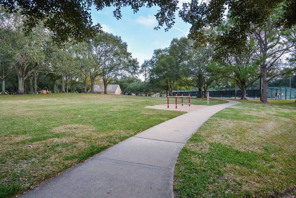 Trail right outside leads to the tennis courts, playground and the Beach club community pool
