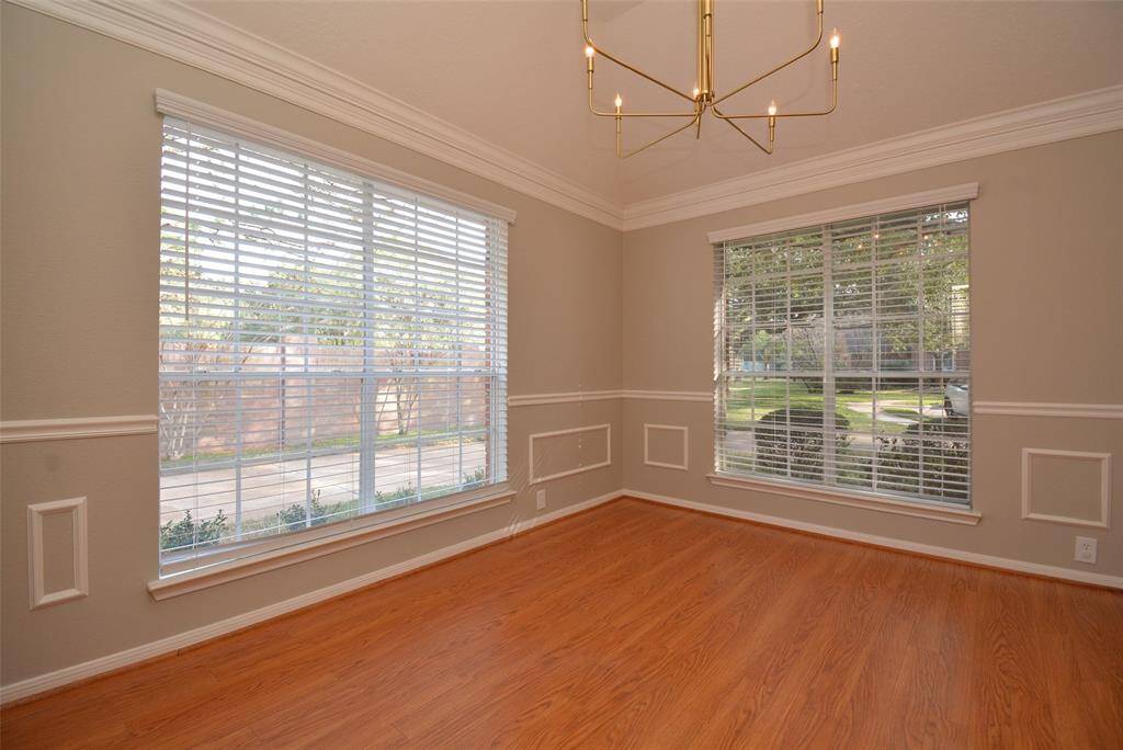 Corner windows illuminate the formal dining room