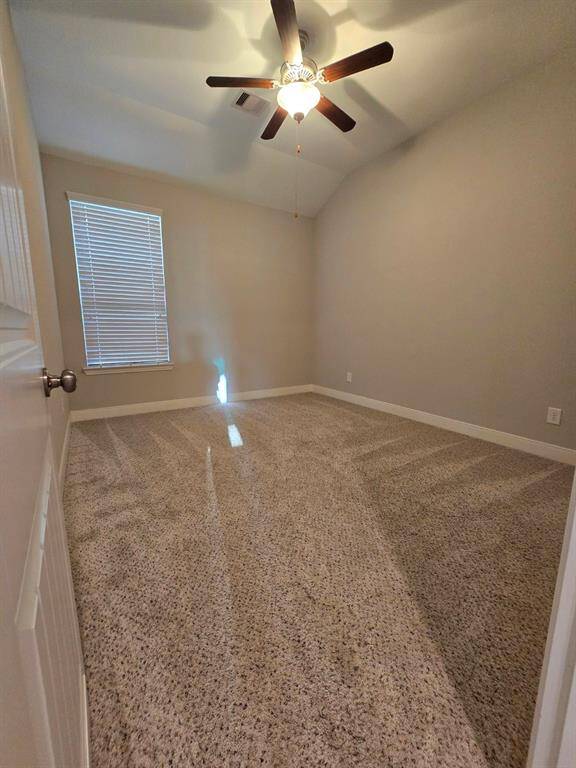 Cozy and inviting secondary bedroom with a ceiling fan for added comfort