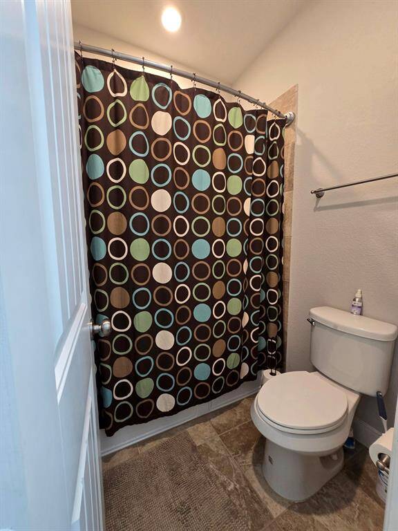 Featuring a shower and tub combo, this secondary bathroom offers versatility and convenience.
