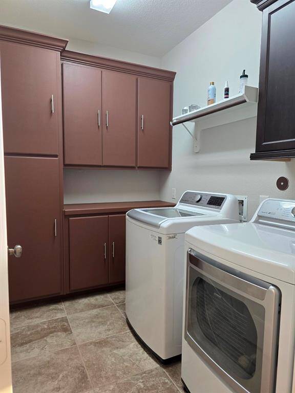 This laundry room provides lots of storage and workspace for all your needs.