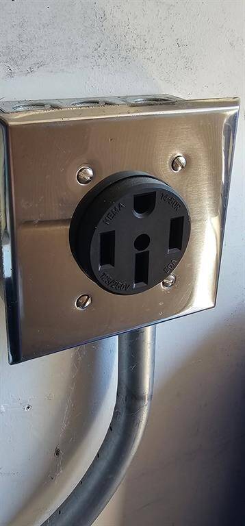 Convenient 50-amp NEMA 14-50R outlet installed in the garage and ready for your electric vehicle charger or other high-power needs.