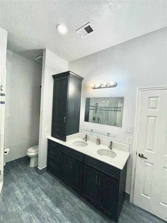master bath with large walk in closet