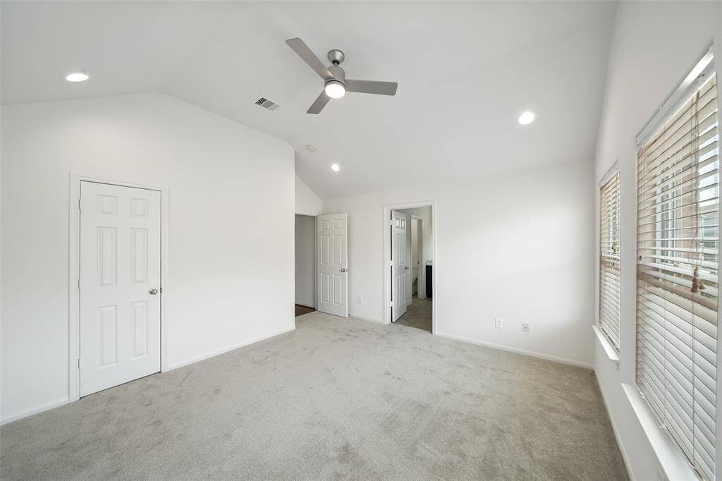 Located at the front of the home, the primary bedroom offers scenic views of the community and surrounding area.