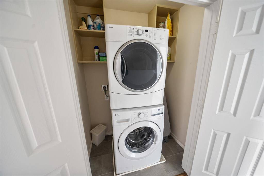 Conveniently located just outside the primary suite, the laundry room is equipped with full-sized washer and dryer.