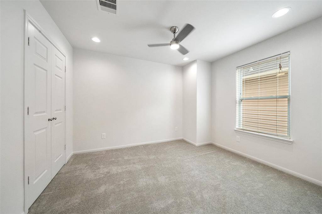 One of two secondary bedrooms upstairs.