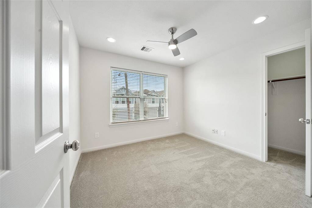 This secondary bedroom features eastern views and a spacious closet.