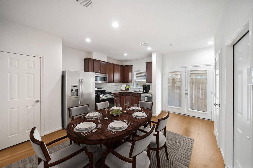 Need a little more space for your get togethers? Remove the island and a dining table fits perfectly within the space. *Virtually staged