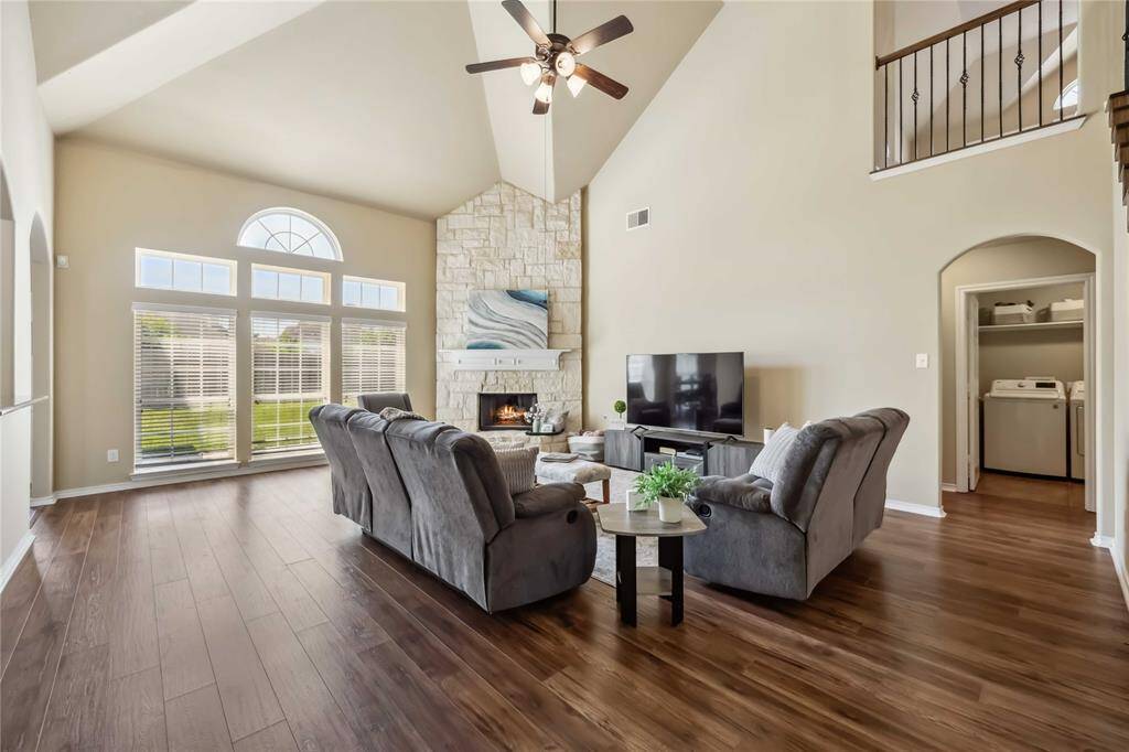 Beautiful wood floors, gorgeous floor to ceiling stone fireplace and soaring 2 story ceilings really gives this space the luxury feel.