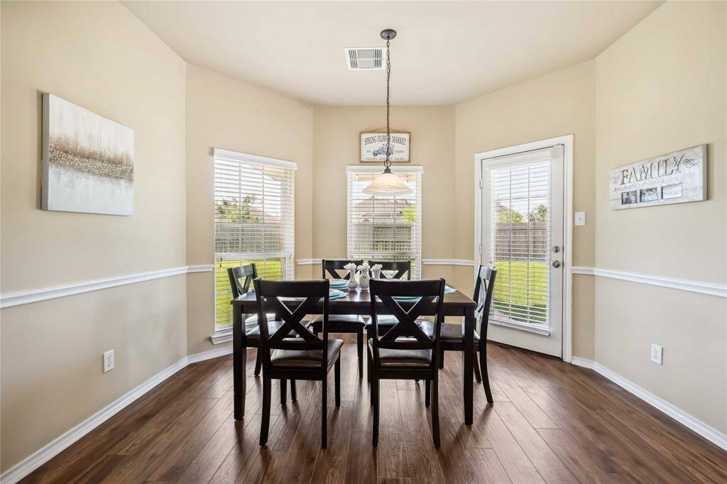 Breakfast area just off the kitchen with entry to back yard patio.