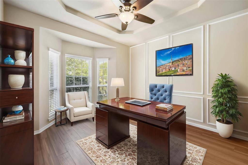 Downstairs home office.  Virtually staged (with furniture removal from current state.)