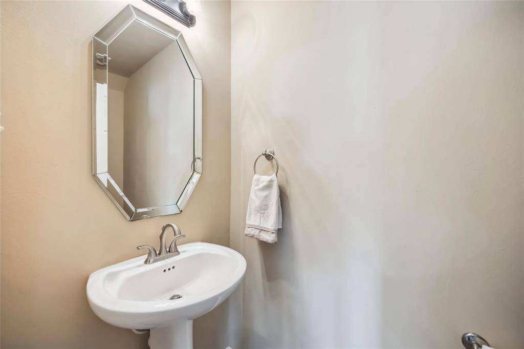 Downstairs powder room just off the family room.