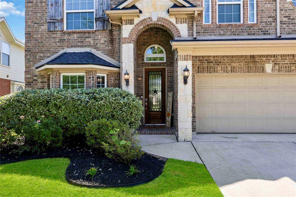 Beautiful brick and stone home with an attached 3 car garage.