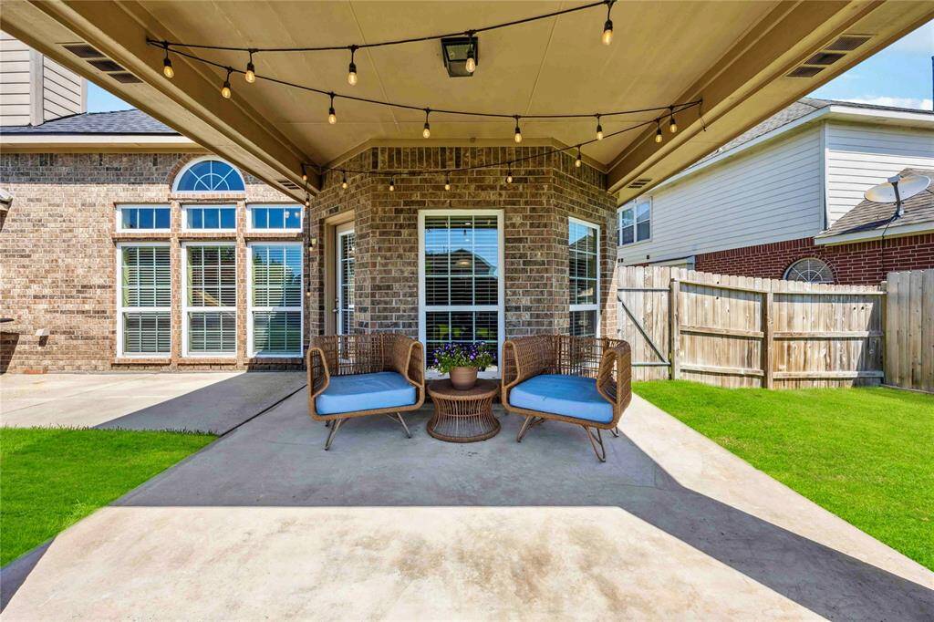 Enjoy your bistro inspired covered patio while grilling out back.