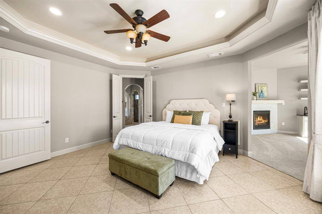 The entrance to the Primary Bath is through elegant double-paneled doors, adding a touch of sophistication. To the right, a private and secluded flex room offers endless possibilities, whether as a second Home Office, Nursery, or personal retreat.