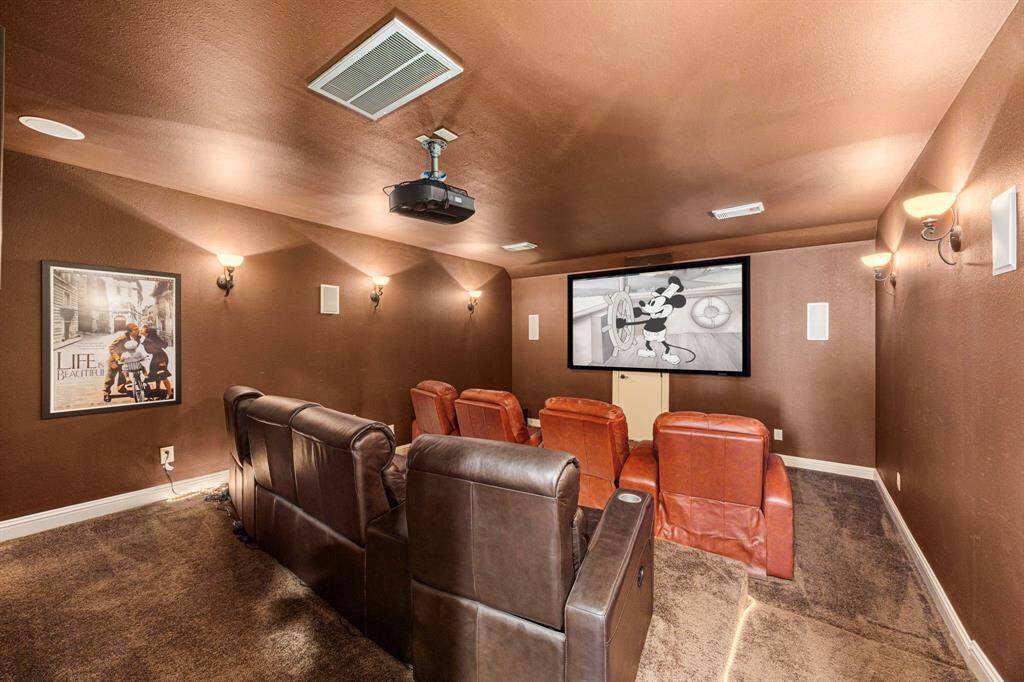 The Media Room is an incredible space designed for the ultimate viewing experience. It features warm, inviting colors, six stylish wall sconces for ambient lighting, a built-in screen, a ceiling-mounted projector, and wall speakers. The stadium-style seating enhances the theater feel, creating a cozy yet high-tech retreat perfect for movie nights, gaming, or watching your favorite shows in cinematic style. Please note: the Media Room loungers are negotiable.