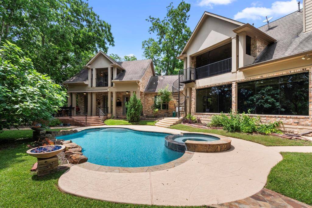 The chlorine pool, built by Blue Haven, is approximately 5-6 feet deep and features a luxurious spa that gently overflows into the pool, creating a tranquil ambiance. Notice the 4 spacious Patios on the backside of the house, offering multiple areas for relaxation, entertaining, and taking in the breathtaking views of the Brazos River and surrounding landscape. Additionally, the Guest Suite is graciously connected to the main house, seamlessly blending into the design while providing a private retreat.
