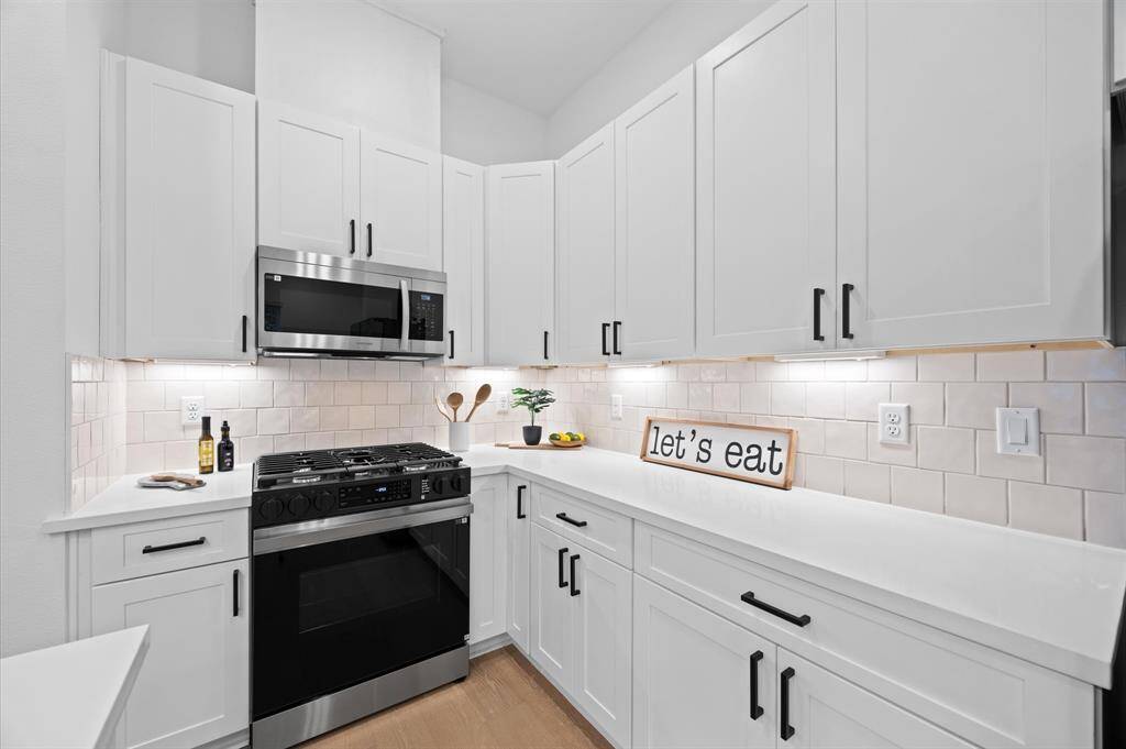 Beautiful kitchen island with plenty of space for food prep and extra sitting area.