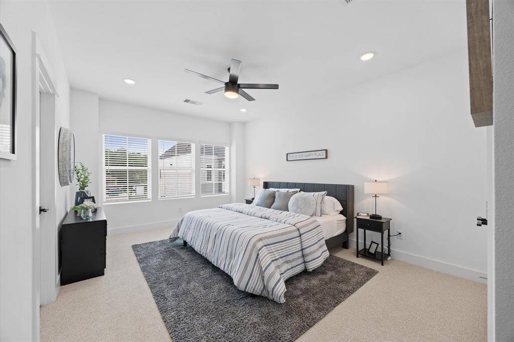 Very spacious primary bedroom located on the 2nd floor. The high ceilings, with recessed lighting, are prewired and blocked for ceiling fans (not included).