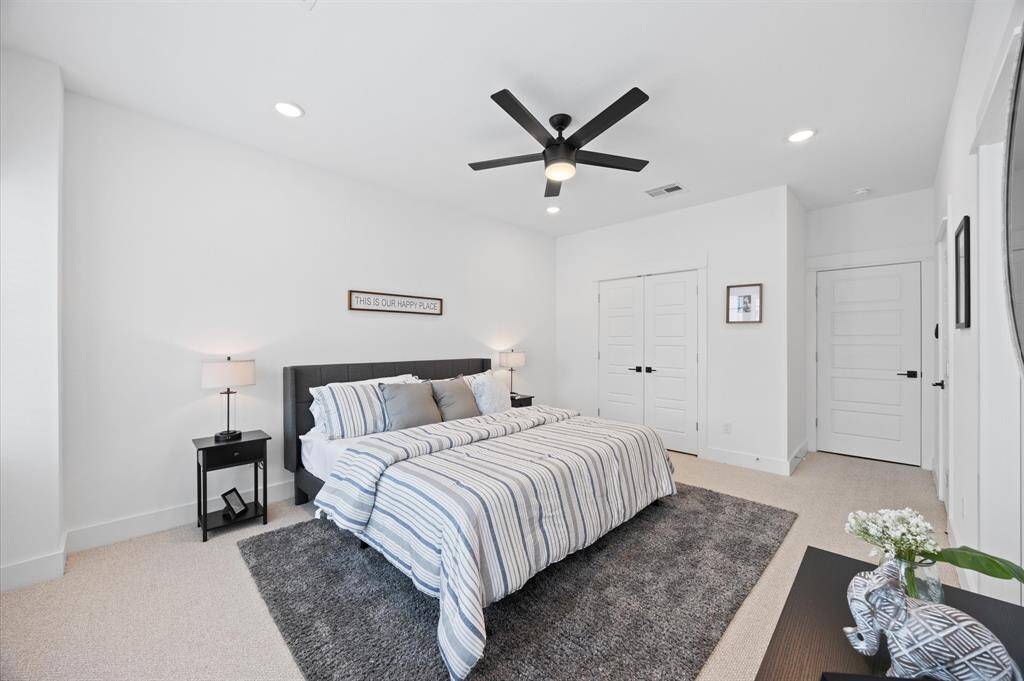 Very spacious primary bedroom located on the 2nd floor. The high ceilings, with recessed lighting, are prewired and blocked for ceiling fans (not included).